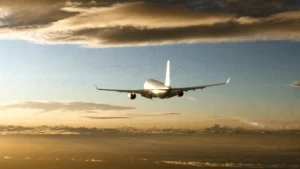 aviation emissions concept with airliner contrail at golden hour