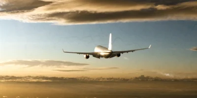 aviation emissions concept with airliner contrail at golden hour