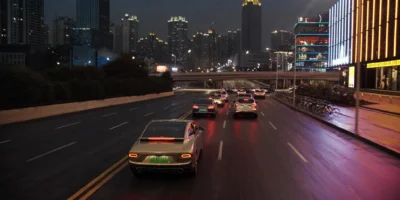 chinese electric cars filling a modern city boulevard at dusk